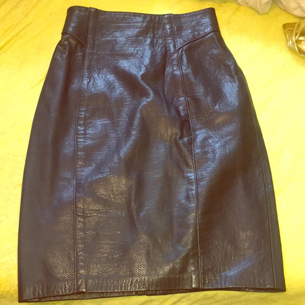 A fitted leather long green pencil skirt